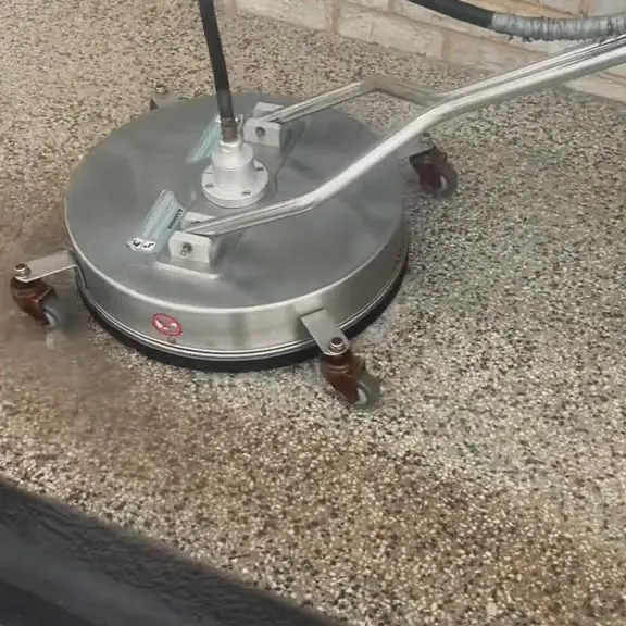 Exterior hard surface being pressure cleaned