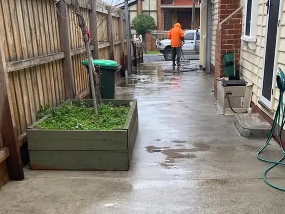 After: the same side path cleaned back to bare concrete