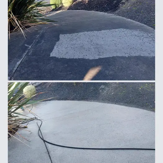 Concrete driveway with a cleaned test strip next to the untouched surface